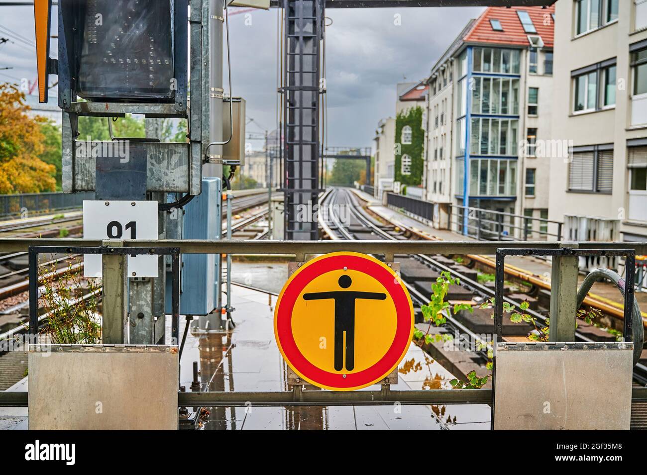 Warning sign on a railroad platform indicating that unauthorized