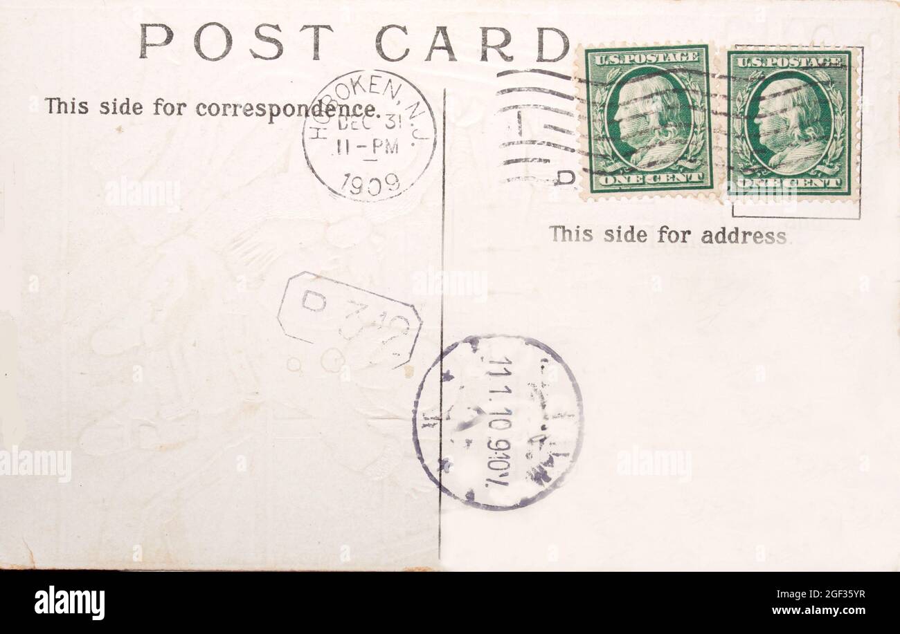 Vintage postcard with two one cent stamps and postmarks of 1909 Stock Photo