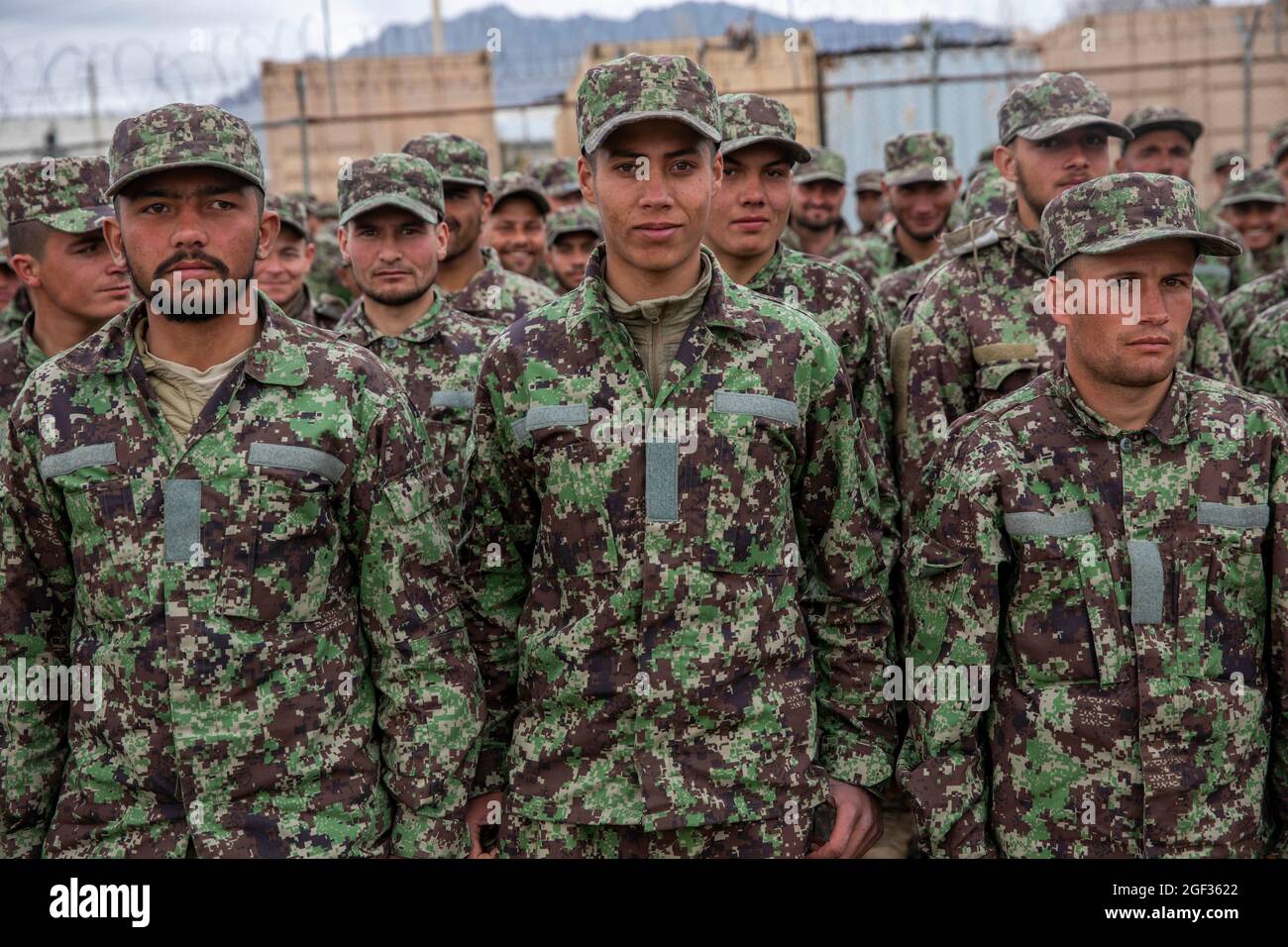 Afghan National Army trainees stand in formation during a visit by Afghan Deputy Defense Minister Dr. Yasin Zia and Resolute Support Commander Gen. Scott Miller in Kabul, Afghanistan, March 5, 2020. Resolute Support is a NATO-led (North Atlantic Treaty Organization) mission to train, advise, and assist the Afghan National Defense and Security Forces and institutions. (U.S. Army Reserve photo by Spc. Jeffery J. Harris/Released) Stock Photo