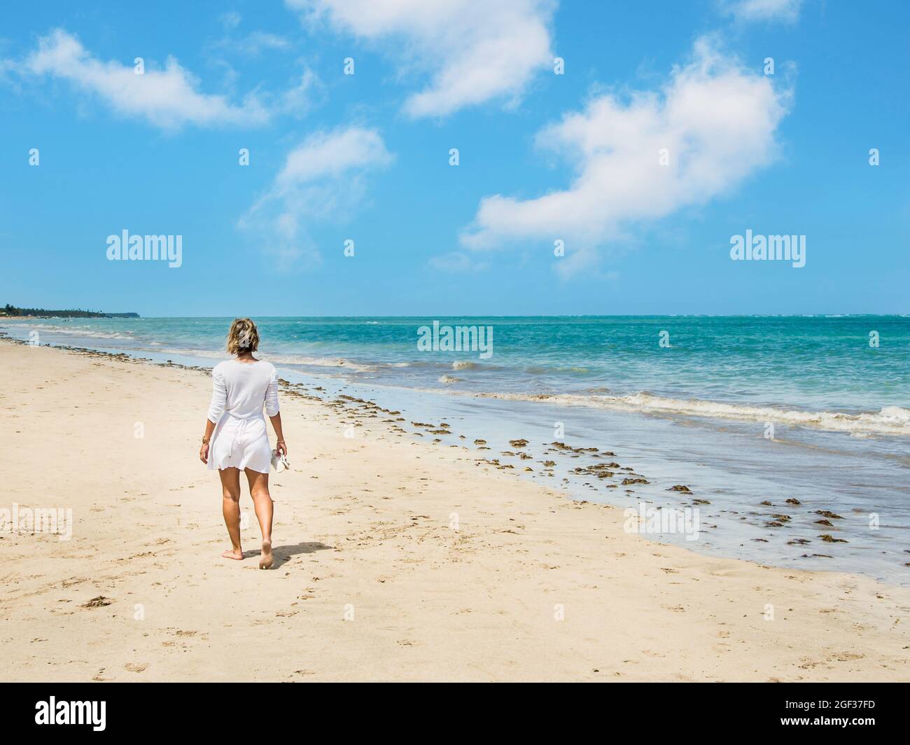 Authentic woman walking along sea hi-res stock photography and images ...