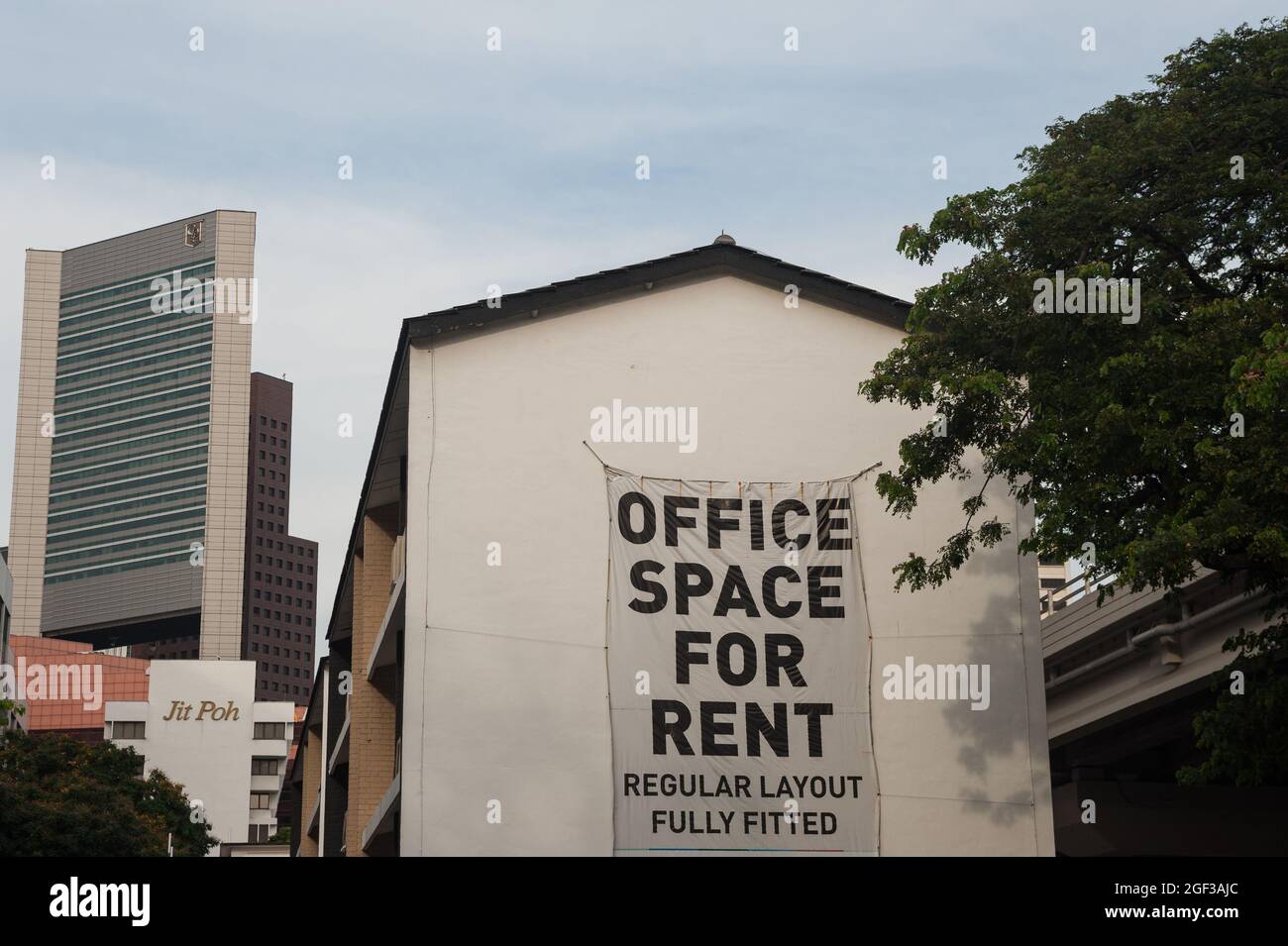 19.07.2017, Singapore, Republic of Singapore, Asia - A banner on a building in the city centre advertises for available Office Space For Rent. Stock Photo