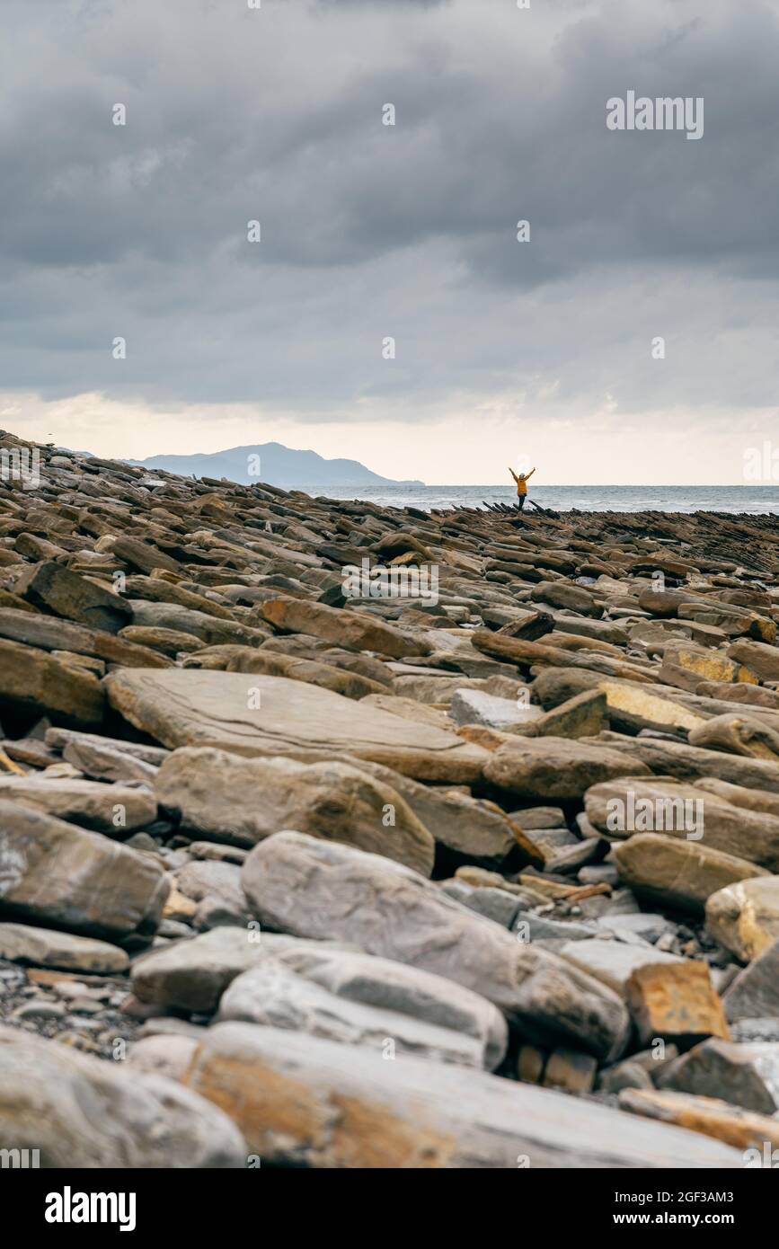 Woman with yellow raincoat hi-res stock photography and images - Alamy