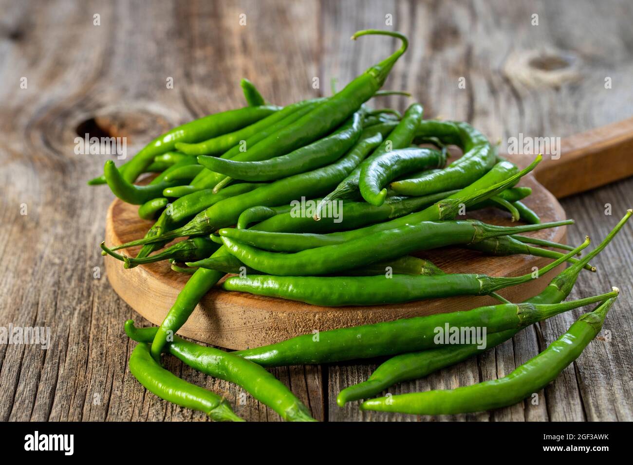 fresh ripe green pepper on wood background Stock Photo