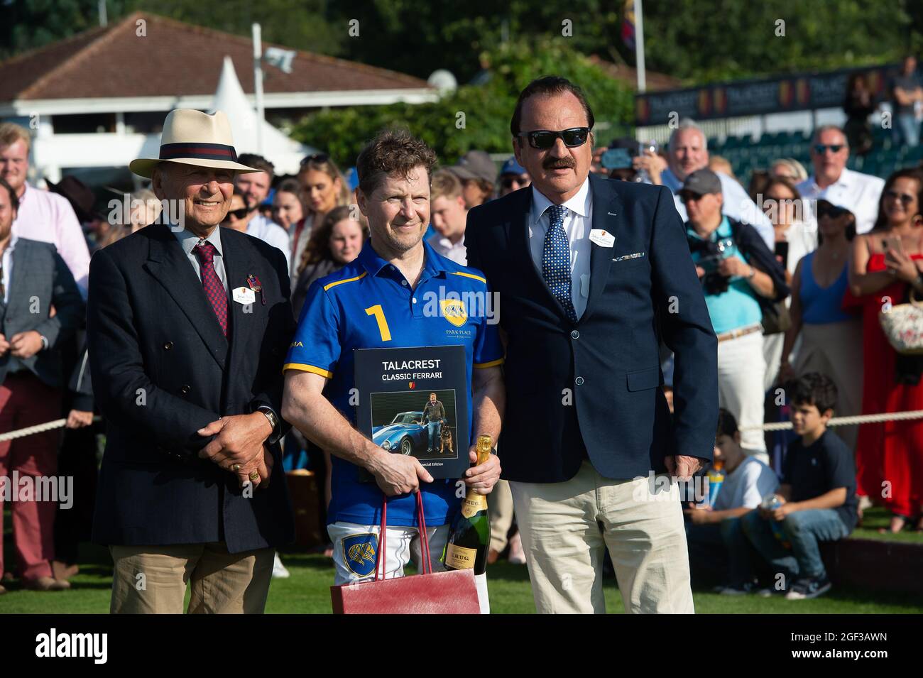 Egham, Surrey, UK. 22nd August, 2021. Polo player Andrey Borodin has a photo with Guards Polo Club Brian Stein (left) and John Collins CEO and Founder of Talacrest (right) after his team Park Place won the Talacrest Prince of Wales's Championship Cup Final at Guards Polo Club. Credit: Maureen McLean/Alamy Stock Photo