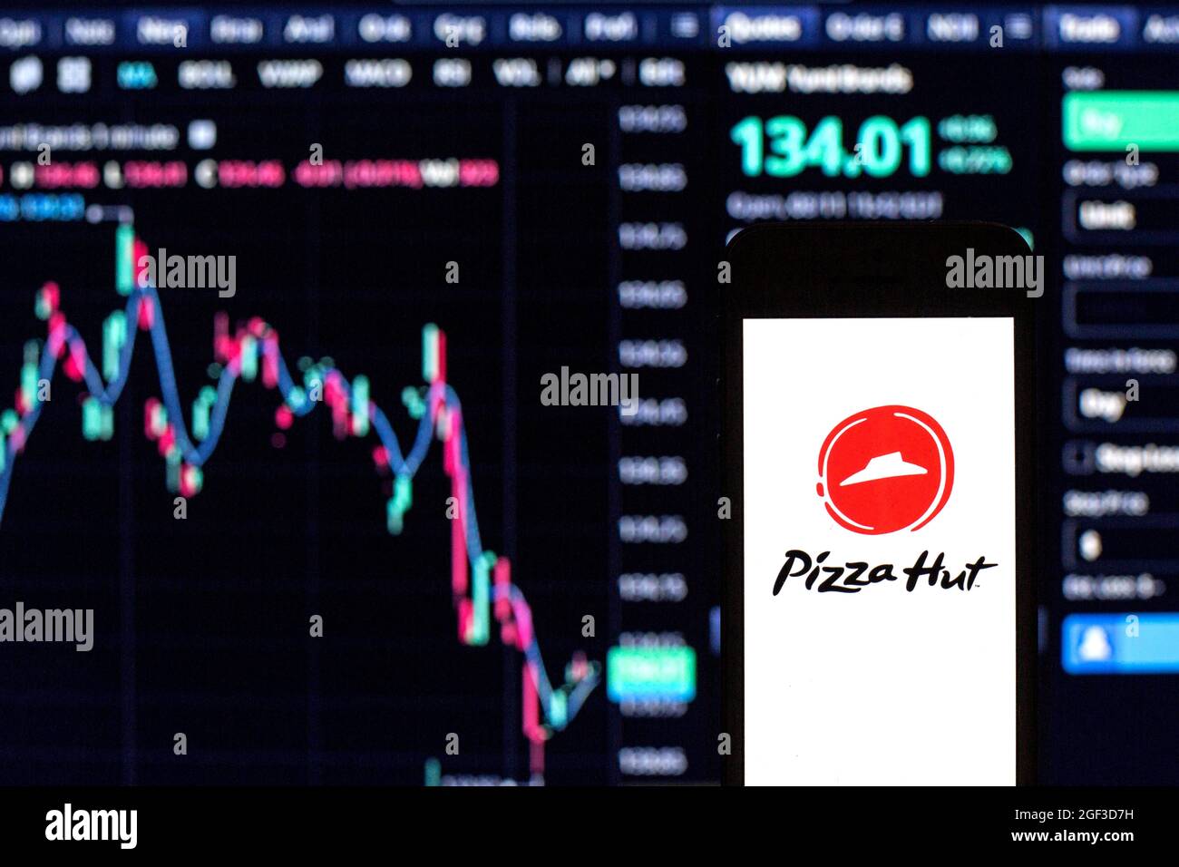 Spain. 11th Aug, 2021. In this photo illustration a Pizza Hut logo seen displayed on a smartphone with the stock market information of Yum! Brands in the background. (Photo by Thiago Prudencio/SOPA Images/Sipa USA) Credit: Sipa USA/Alamy Live News Stock Photo