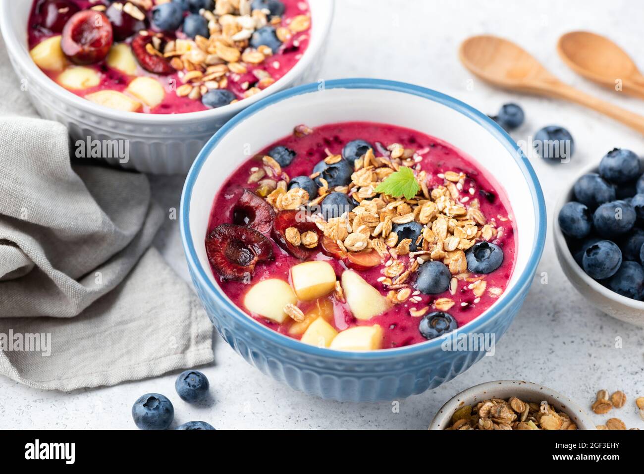 Superfood smoothie bowl with granola and berry topping. Low calorie vegan detox meal Stock Photo