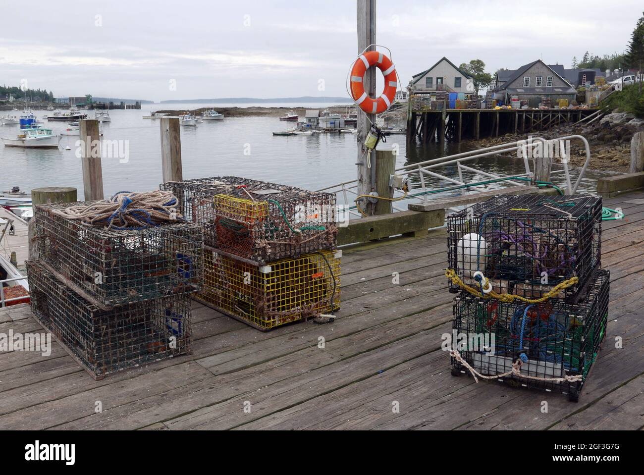 Lobster pots on the Town Wharf in Bernard on Bass Harbor,Mt Desert, Maine. Top right is Thurstons Lobster Pound. Stock Photo