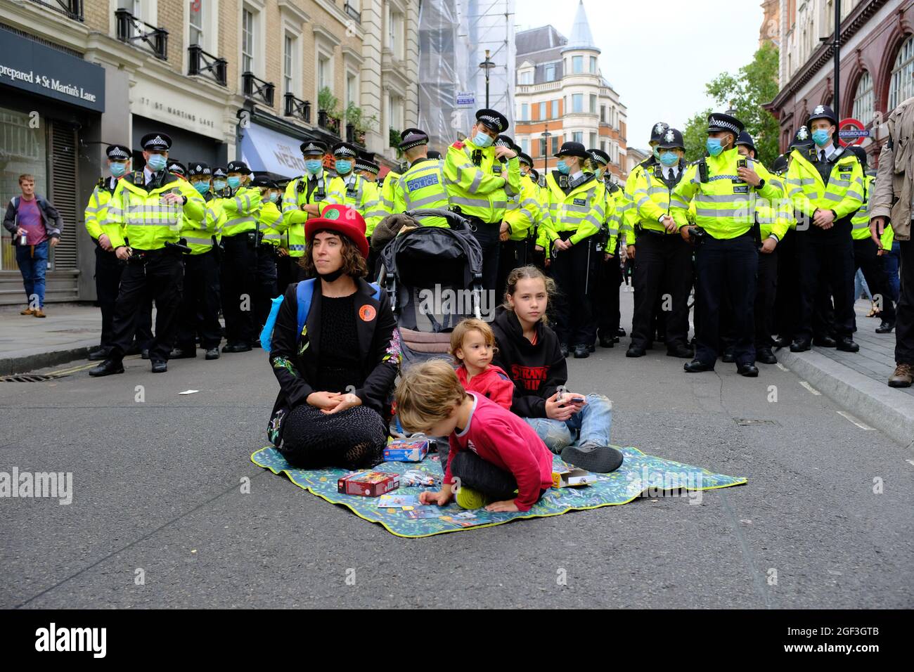 LONDON - 23RD AUGUST 2021: Extinction Rebellion climate change activists occupy the Long Acre crossroads in the West End of London. Stock Photo