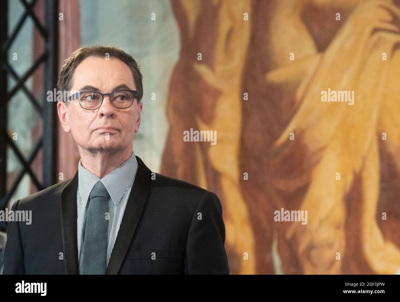 Hanover, Germany. 23rd Aug, 2021. Publisher Gerhard Steidl stands while receiving the Grand Cross of Merit of the Order of Merit of Lower Saxony in the Herrenhausen Gallery. To mark the 75th anniversary of Lower Saxony, a total of 22 citizens were honoured with the state's Order of Merit. Credit: Julian Stratenschulte/dpa/Alamy Live News Stock Photo