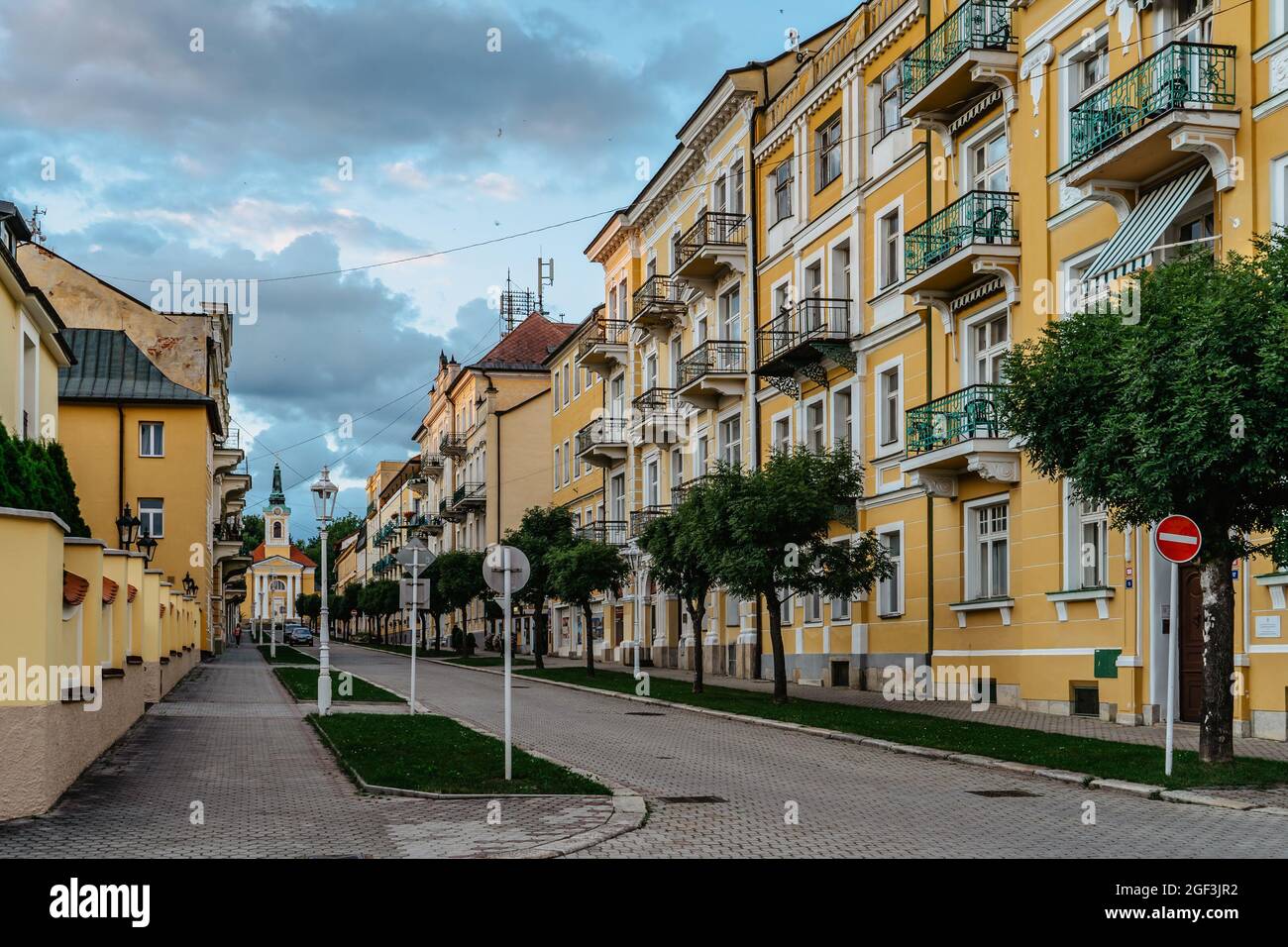 Frantiskovy Lazne-Czech Republic - August 20, 2021.Lovely spa town in West Bohemia,thermal buildings with typical yellow facade,neo-Classical colonnad Stock Photo