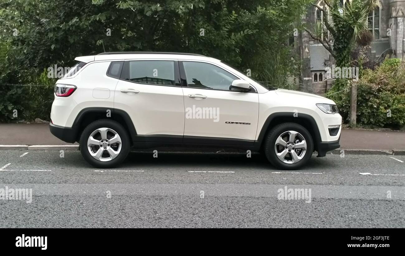 A white 2021 Jeep Compass parked in Torquay, Devon, England, UK Stock