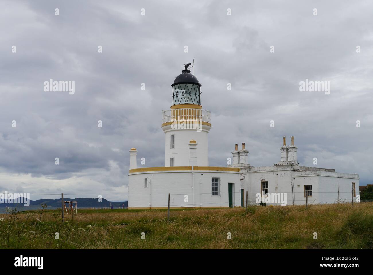 Lighthouse on Black Island in Scotland Stock Photo