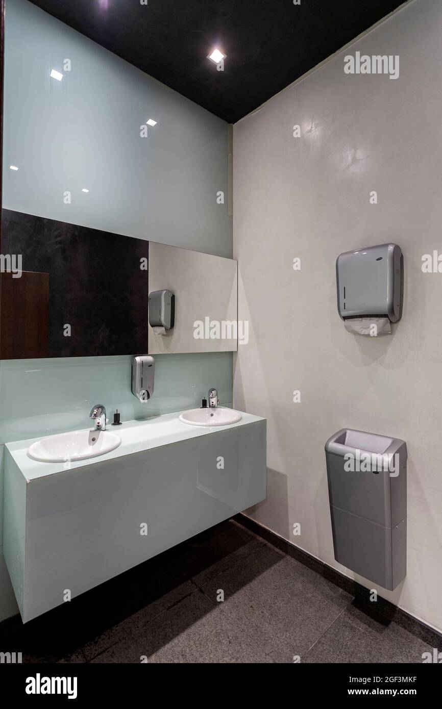 Office bathroom design, porcelain wash basin in modern office Stock