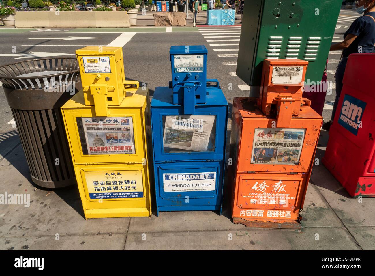 Newspaper boxes lined up in a row for Chinese oriented newspapers, the Epoch Times, China Daily and The China Press in the Flatiron neighborhood in New York on Thursday, August 12, 2021 (© Richard B. Levine) Stock Photo
