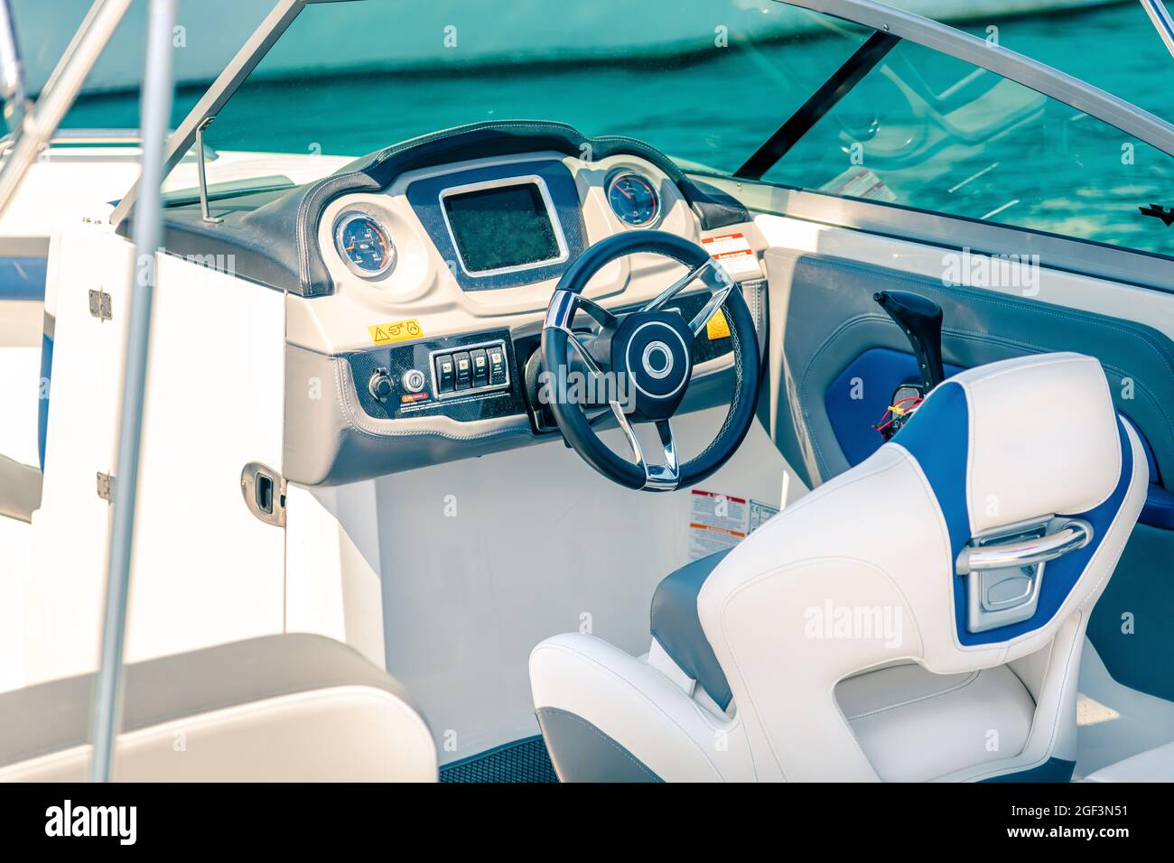 Steering wheel on expensive luxury yacht cabin. Detail of the interior