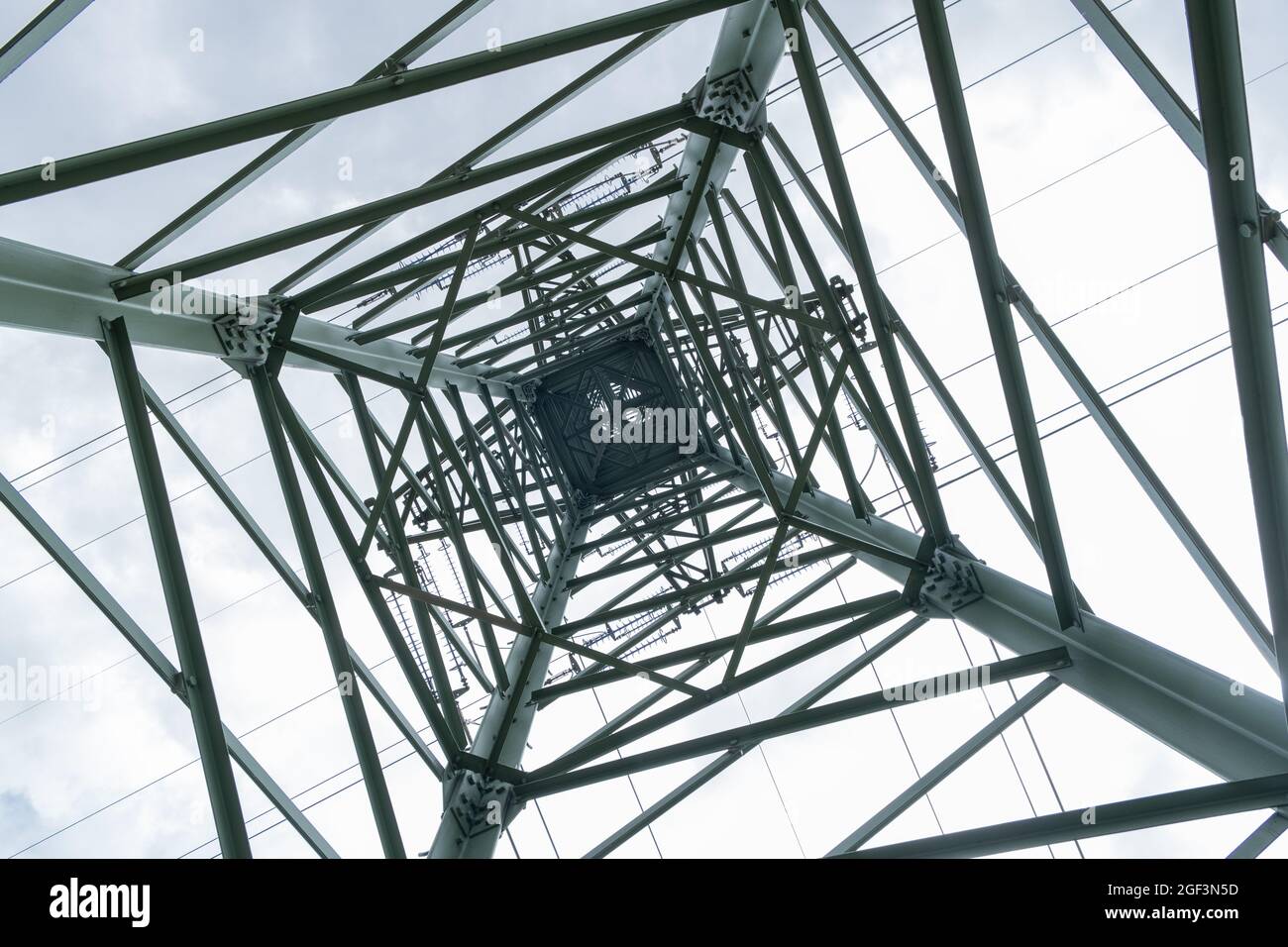 High metal electro tower against the sky. High voltage Power lines ...