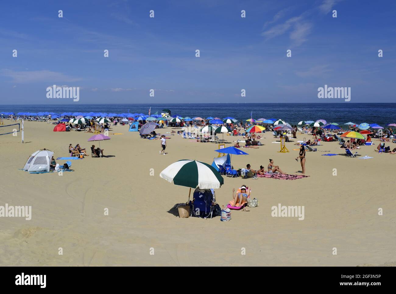 LONG BRANCH NJ, UNITED STATES - Aug 15, 2021: Large crowds enjoying a sunny beach day  in Long Branch along the New Jersey Shore Stock Photo