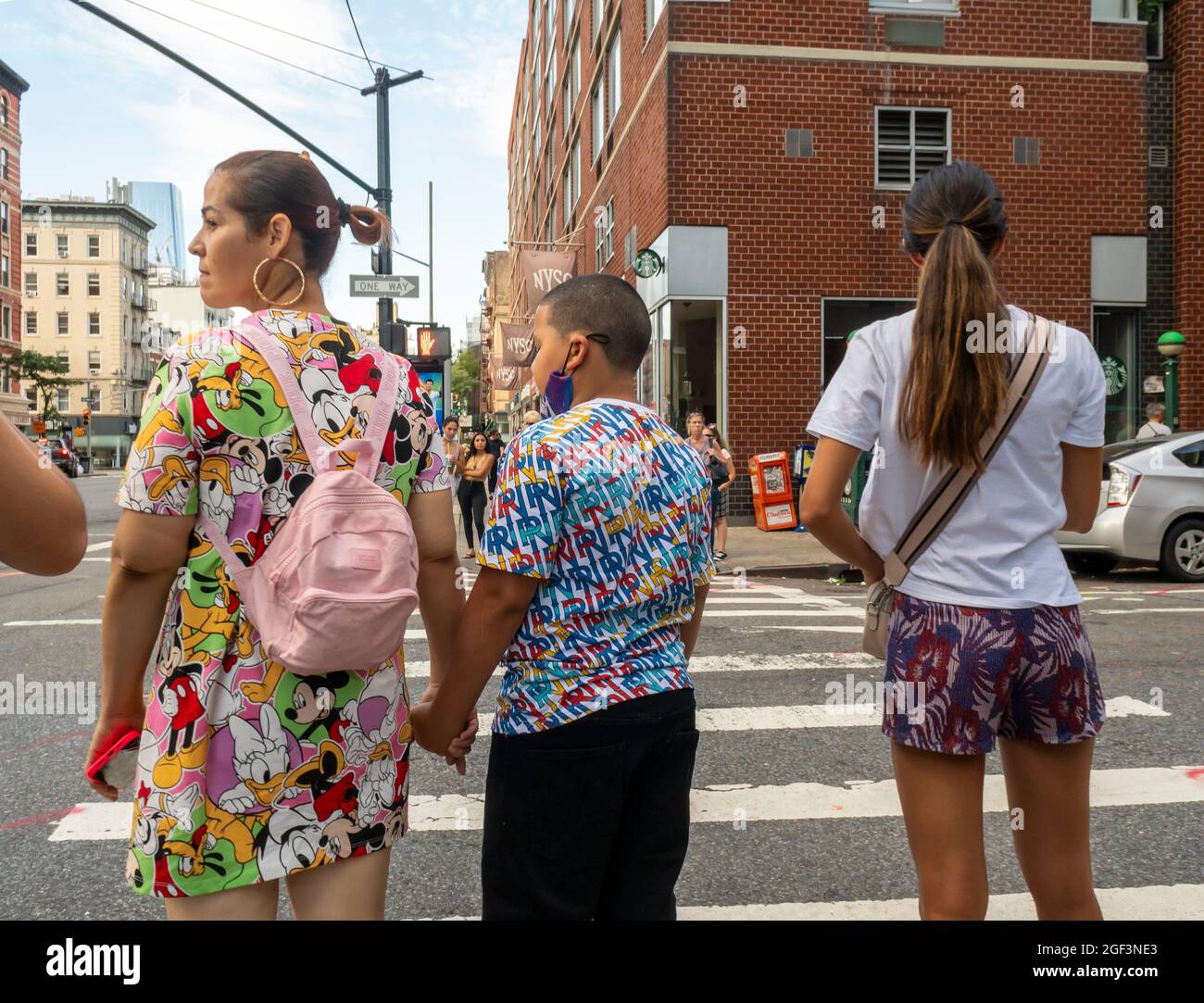 Street fashion, including Disney branded merchandise, in the Chelsea neighborhood of New York on Sunday, August 15, 2021 (© Richard B. Levine) Stock Photo