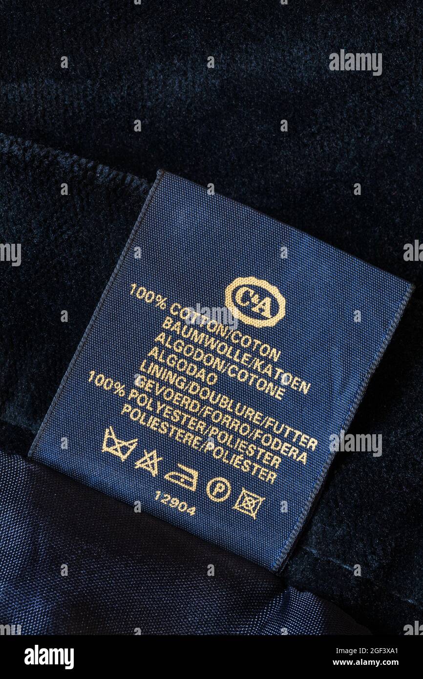 Label in ladies black skirt by C&A 100% cotton lining 100% polyester with Care washing symbols Stock Photo
