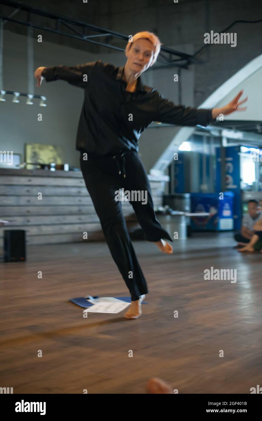 solo dancer move in contemporary improvisation performance Stock Photo