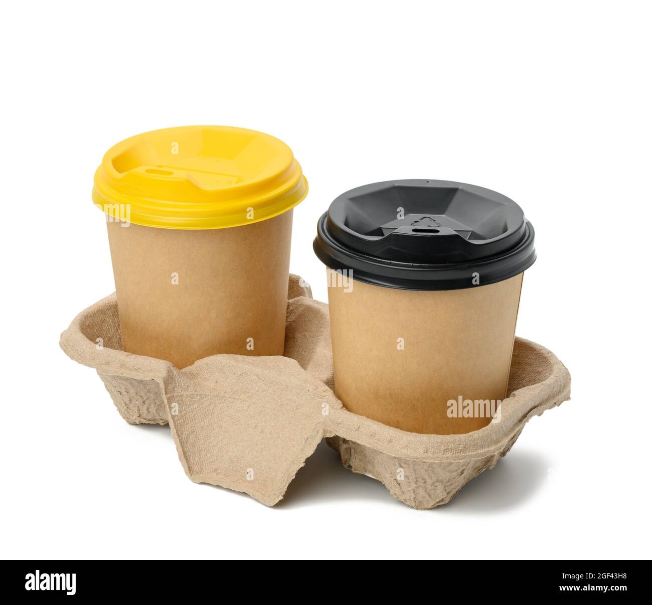 disposable brown cups with plastic lid stand in holder on white