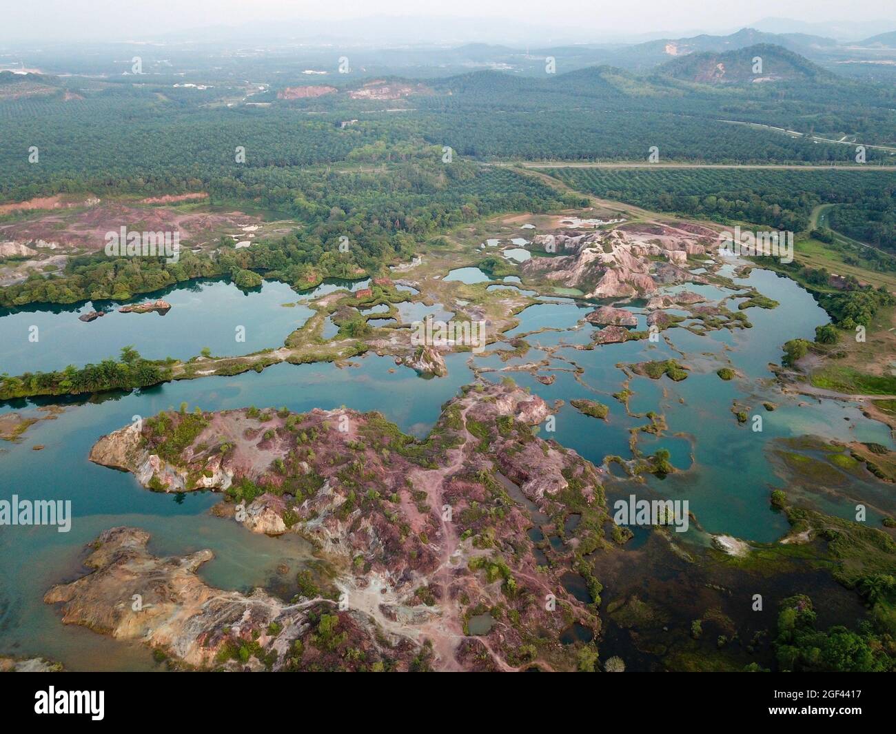 Drone view abandoned quarry with green lake. Beautiful lake. Stock Photo