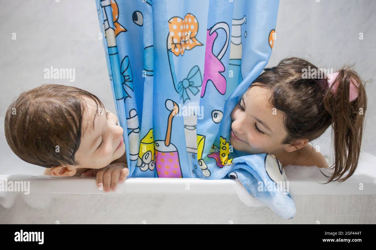 Children enjoy bathing. Leisure time bathtub time for children concept. Stock Photo