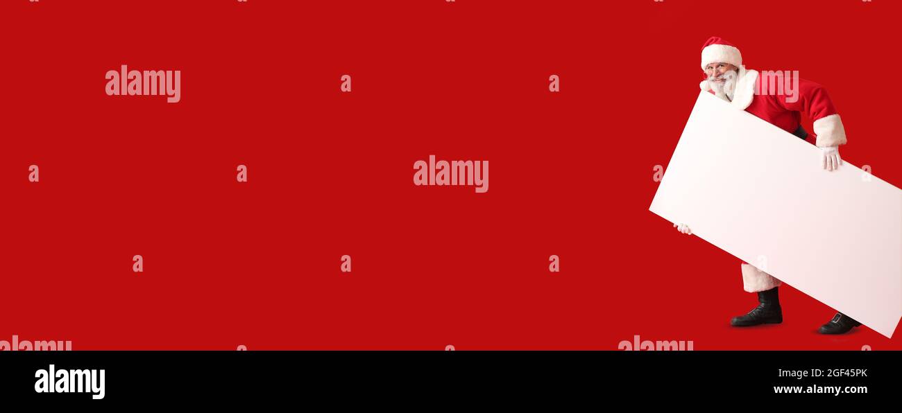 Santa Claus with blank poster on color background with space for text ...