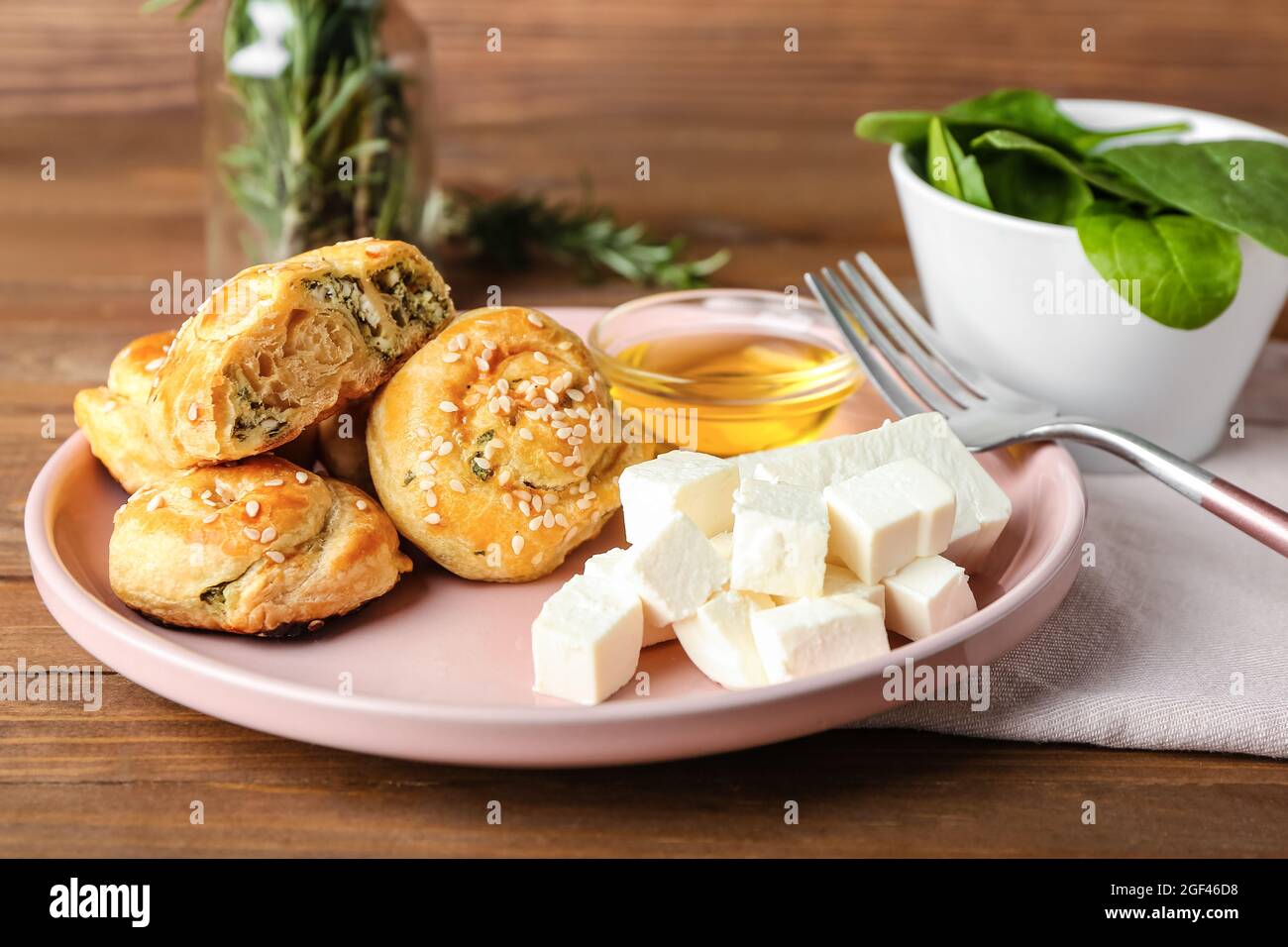 Puff pastry stuffed with spinach and feta cheese on table Stock Photo