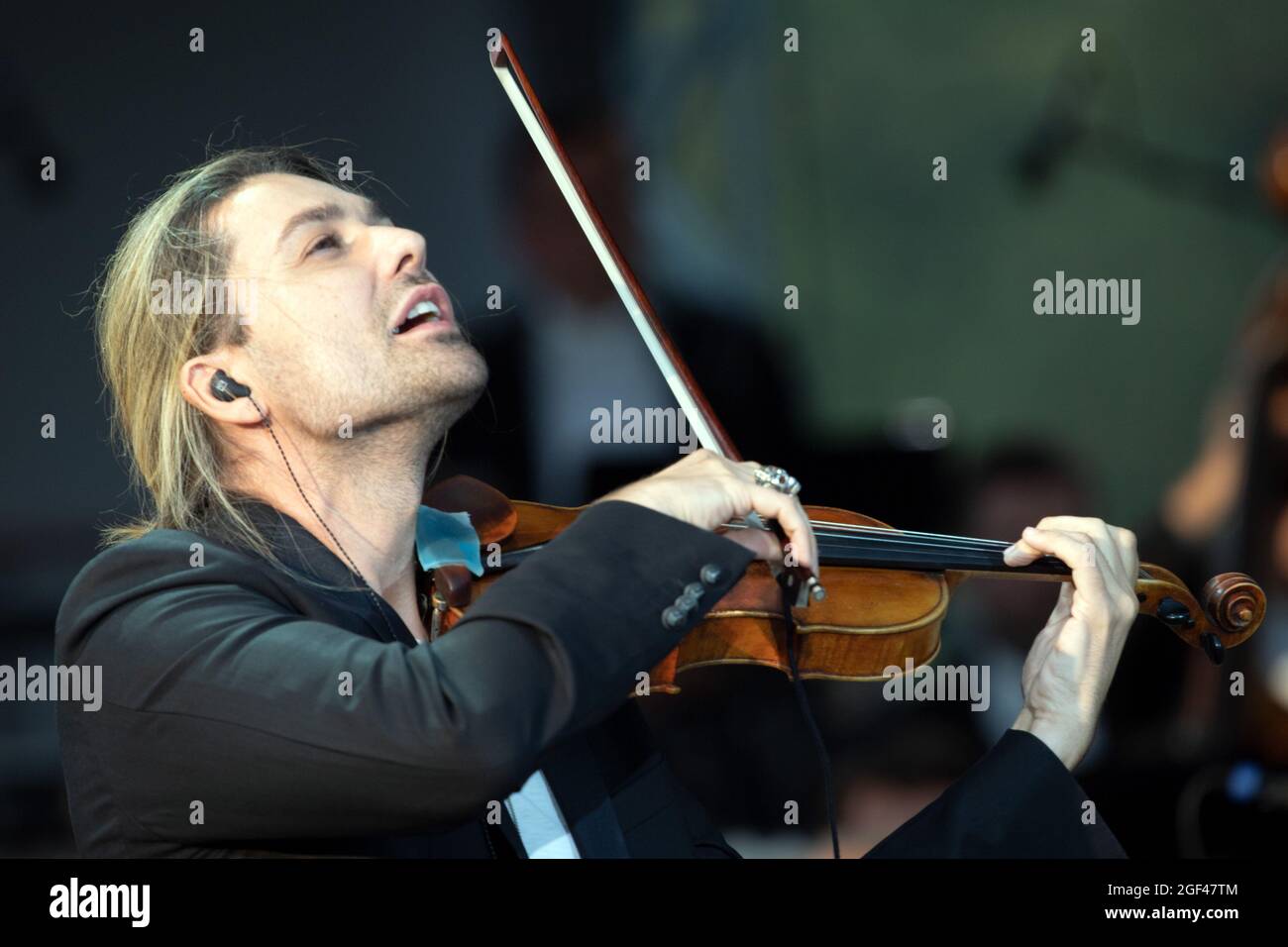 Duesseldorf, Germany. 23rd Aug, 2021. David Garrett plays the violin on the grounds of the racecourse. The state of North Rhine-Westphalia celebrates its 75th birthday with a ceremony. Credit: Federico Gambarini/dpa/Alamy Live News Stock Photo