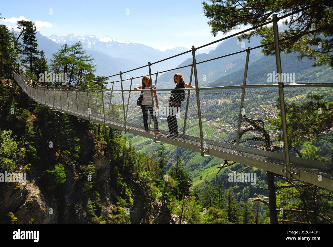 Bisse du Torrent Neuf or Bisse de Savièse - Cliffside walk and suspension bridge, Bisses, only found in the Valais region of Swtizerland, are Stock Photo