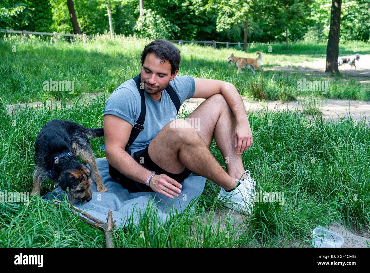 Berlin, Germany. Man playing with his new dog inside the doggy