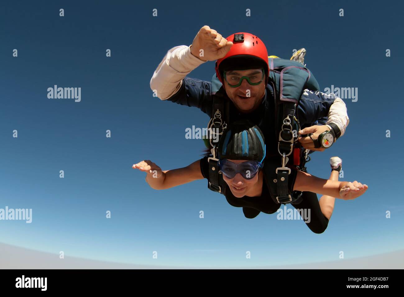 August 21, 2012. Toledo, Spain. An Instructor and a Female Student Jump Tandem Parachutes on a summer day in Spain. Stock Photo