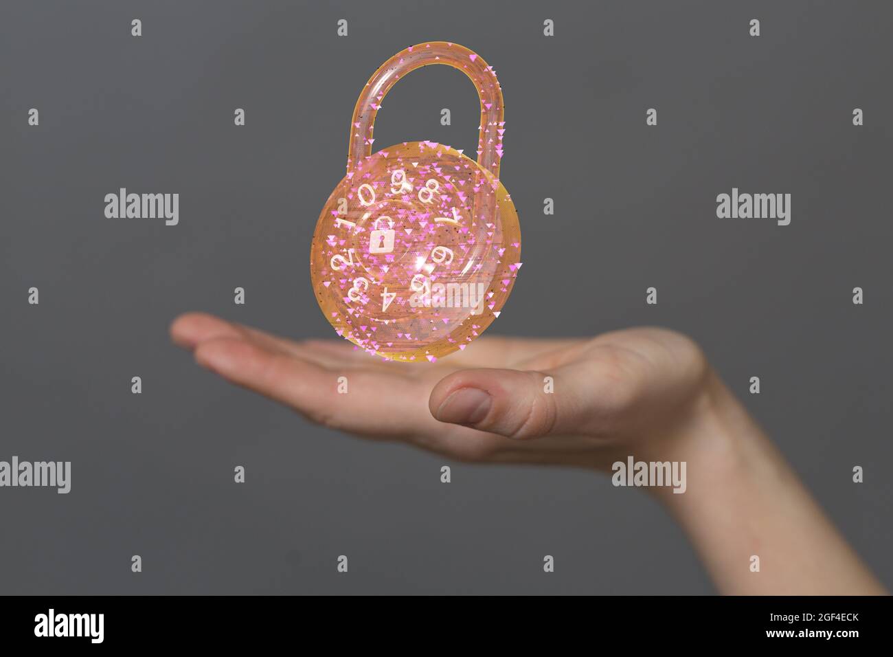 Man holding the virtual 3D padlock icon symbolizing data security isolated on a gray background Stock Photo