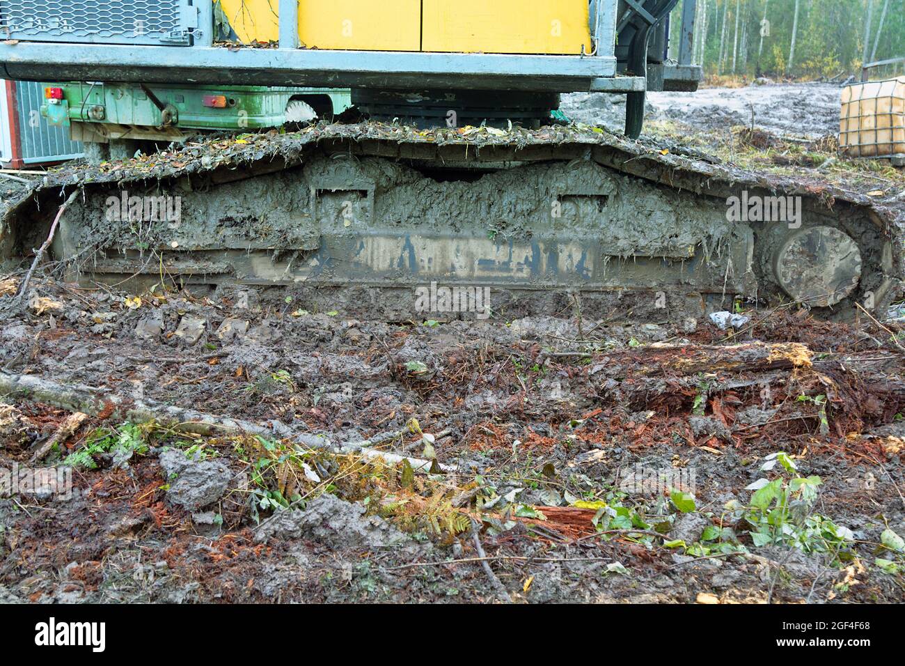 Movement of earth. Dirty excavator tracks after working in swampy terrain Stock Photo