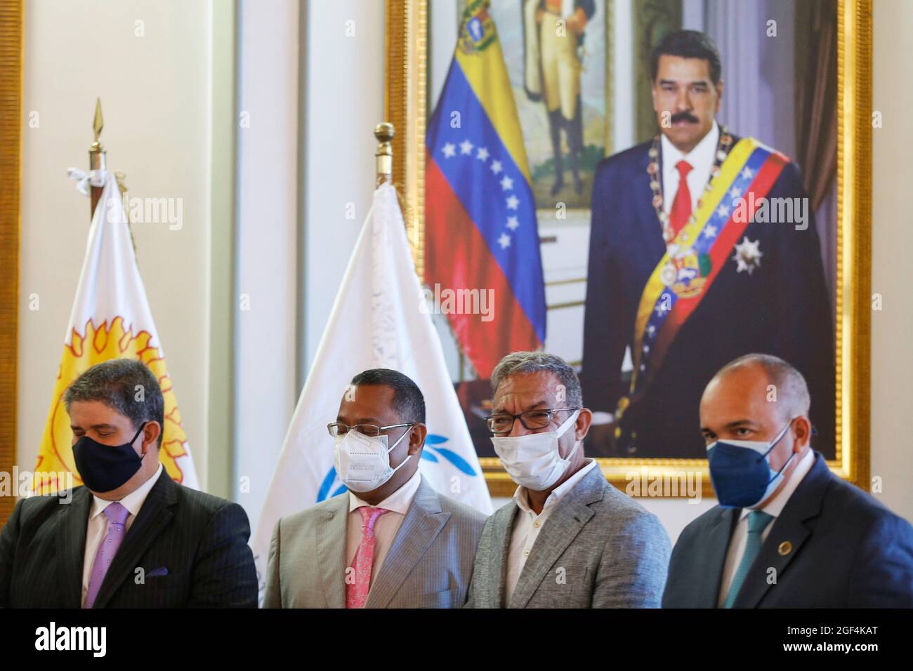 Caracas, Venezuela. 23rd Aug, 2021. Duarte Pacheco (2nd from right), president of the Inter-Parliamentary Union (IPU), smiles after his arrival at Simon Bolivar International Airport. A delegation of the IPU is to hold talks with Venezuelan MPs on the spot. Credit: Jesus Vargas/dpa/Alamy Live News Stock Photo