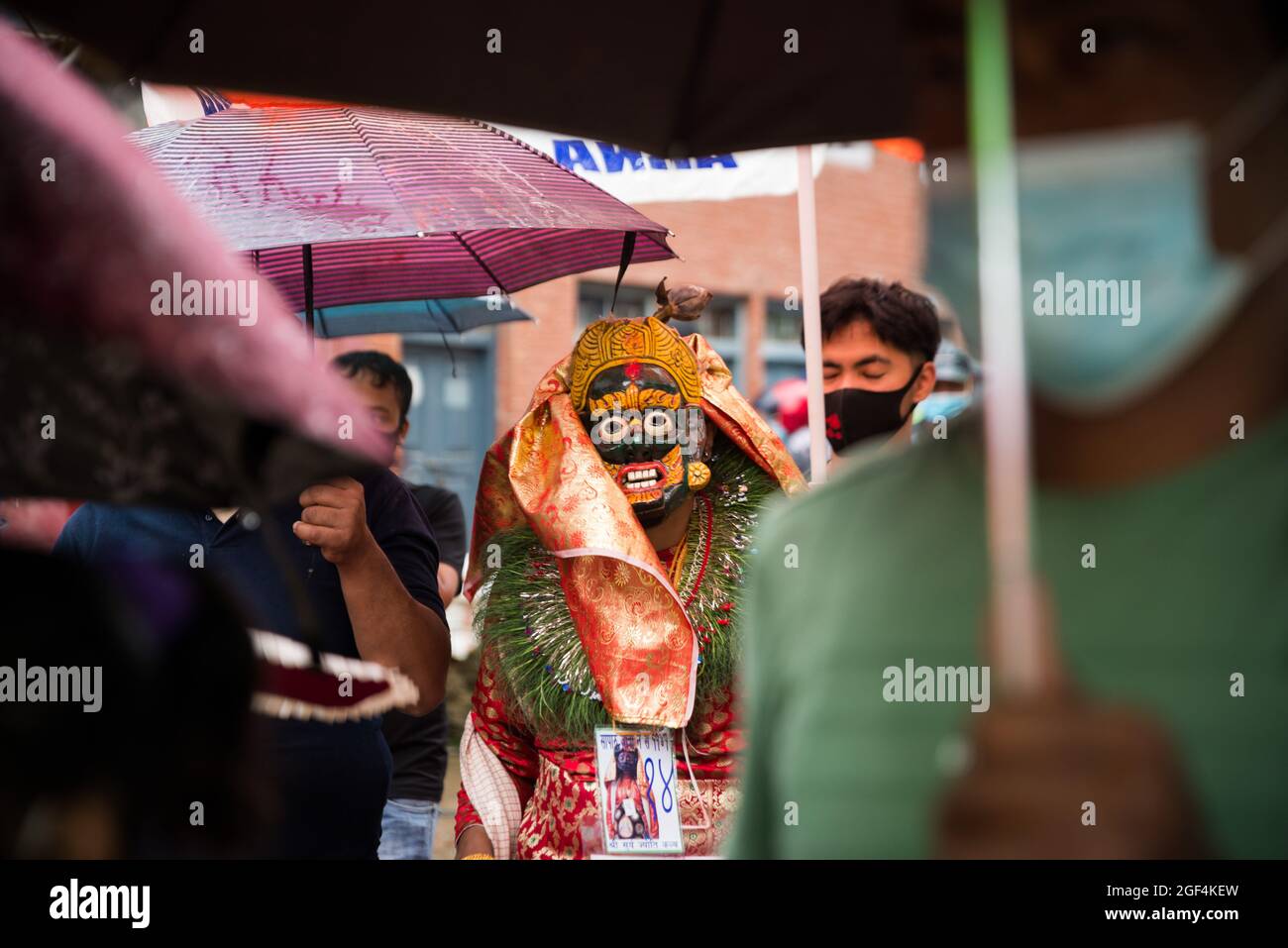 Kathmandu, Nepal. 23rd Aug, 2021. A man dressed in a traditional costume performs during the festival.People celebrate Gai Jatra or cow festival in the memory of departed souls in the past year for salvation and peace. It is believed that cows guide the departed souls to cross the river to get to heaven. (Photo by Bivas Shrestha/SOPA Images/Sipa USA) Credit: Sipa USA/Alamy Live News Stock Photo