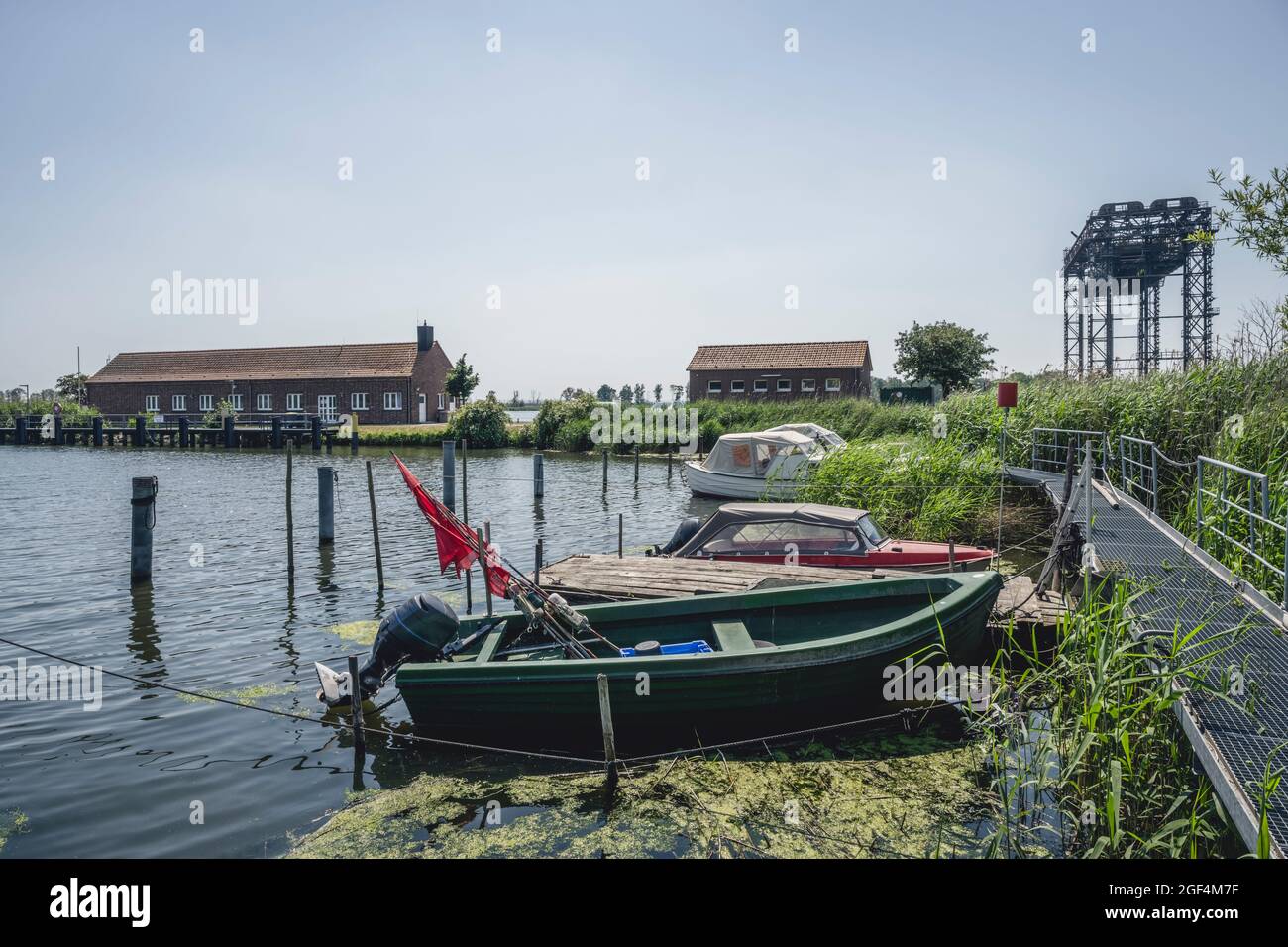 Motorboats moored at lakeshore in summer Stock Photo