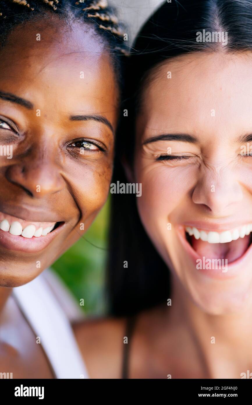 Laughing young woman with female friend Stock Photo