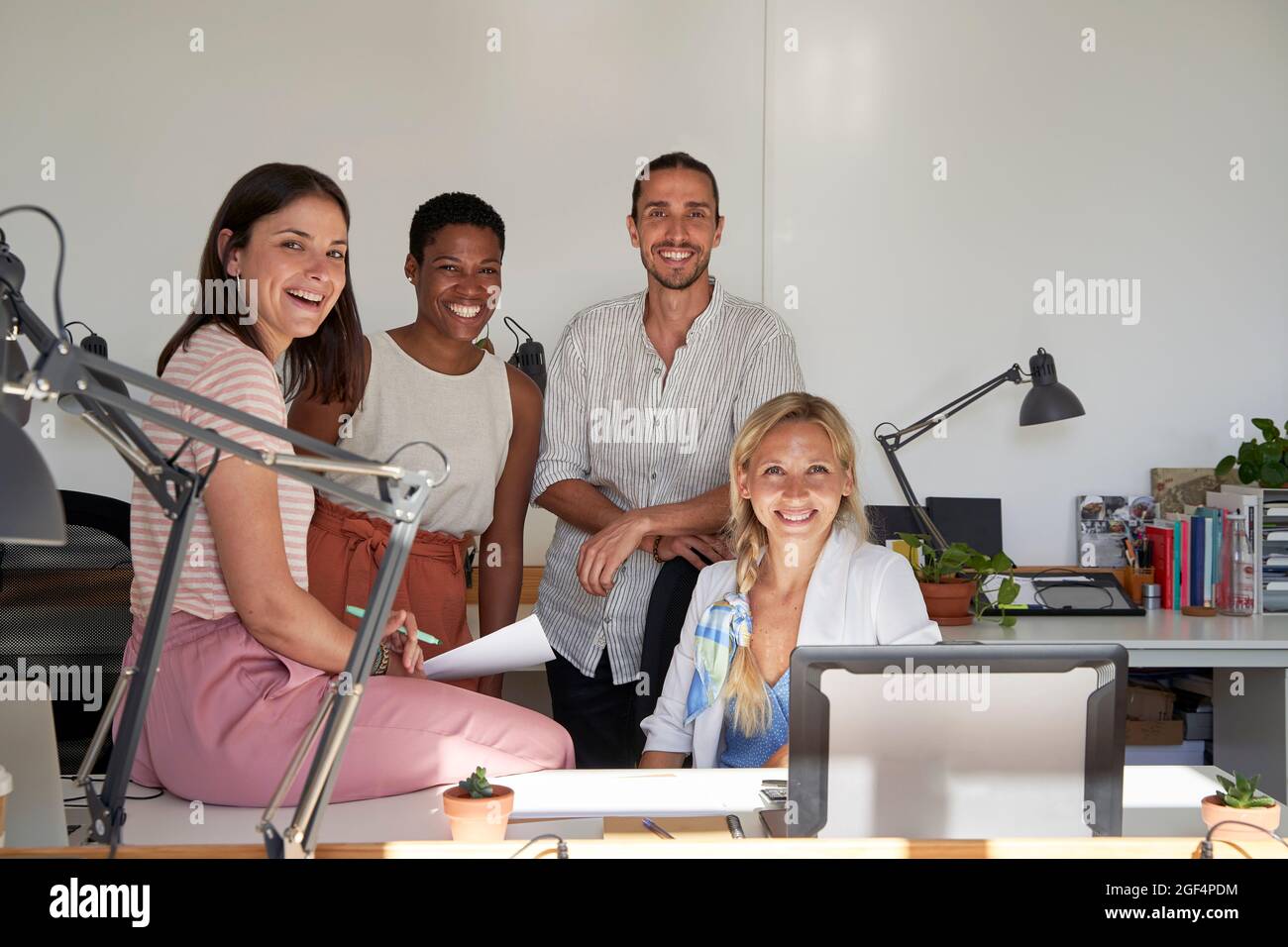 Happy male and female professionals at office Stock Photo