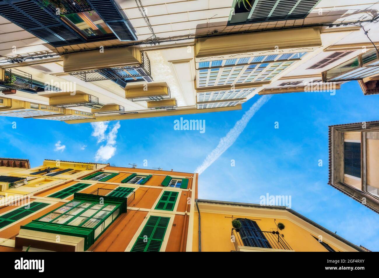 Spain, Mallorca, Palma de Mallorca, Directly below view of sky over residential city buildings Stock Photo