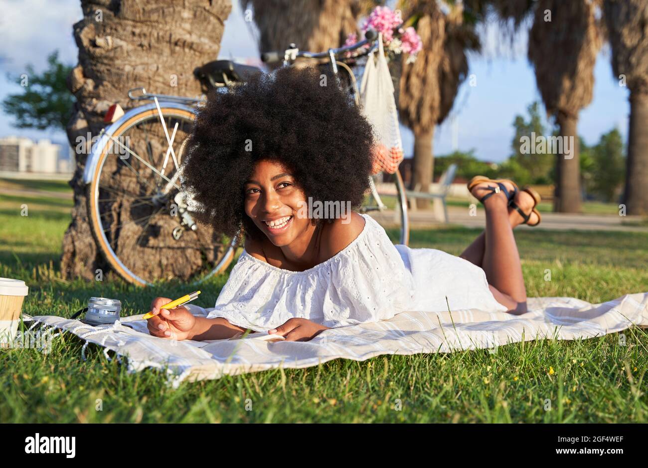 Happy young afro woman hi-res stock photography and images - Alamy