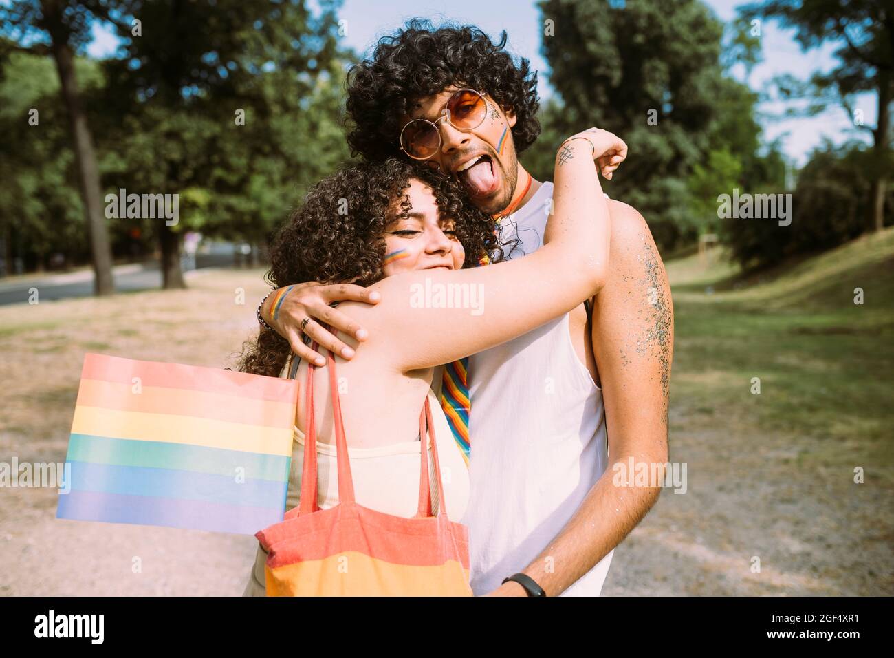 Young woman embracing man in park Stock Photo