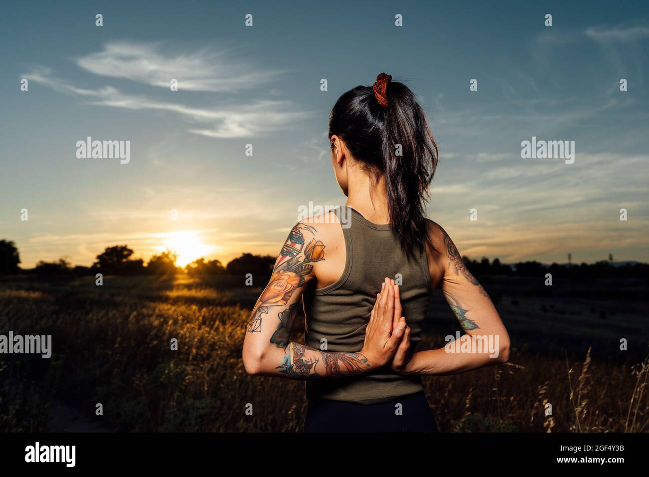 Woman hands clasped behind back hi-res stock photography and images - Alamy