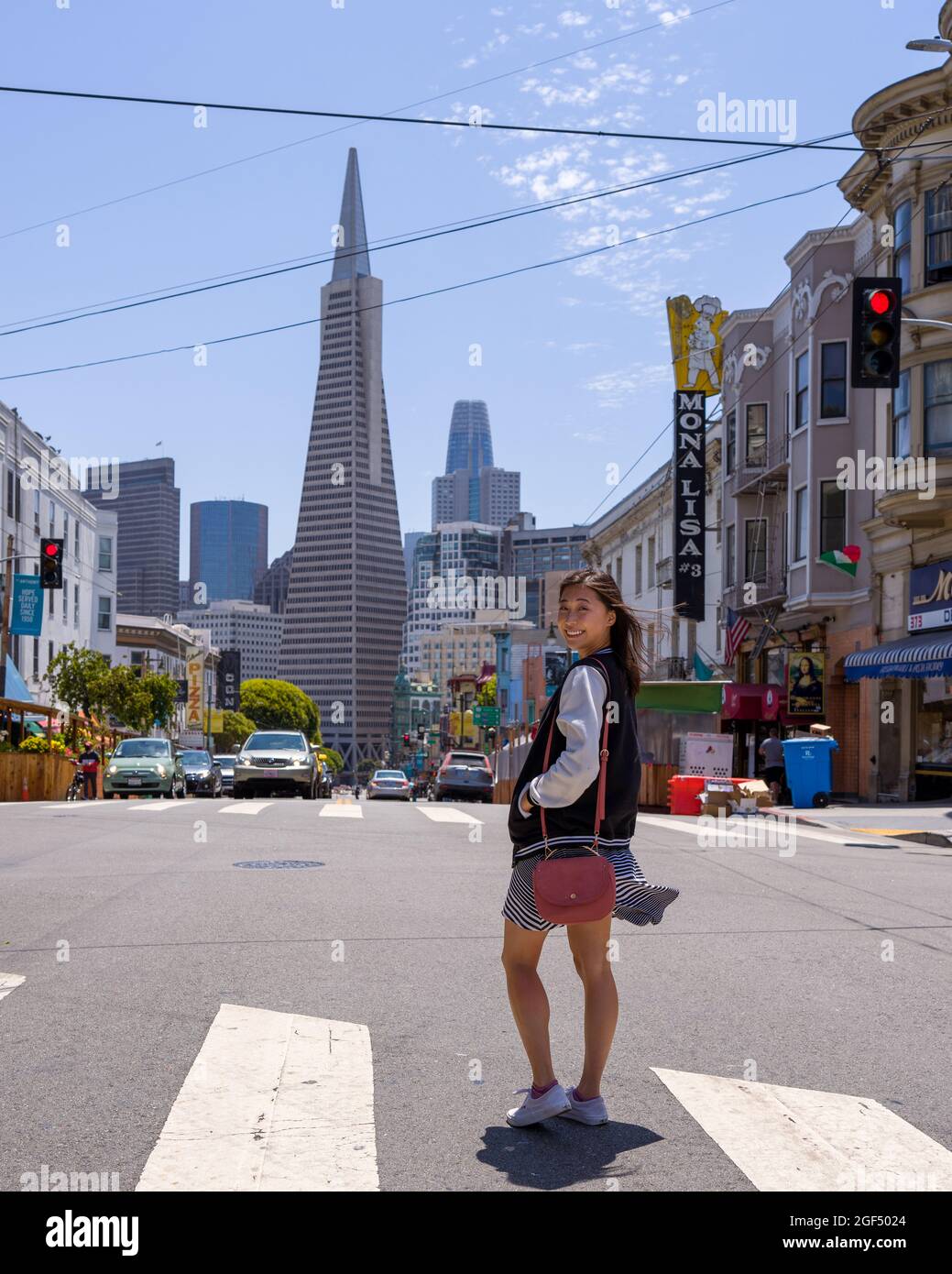 Young Asian Woman Crossing Street in Iconic North Beach San Francisco Stock Photo