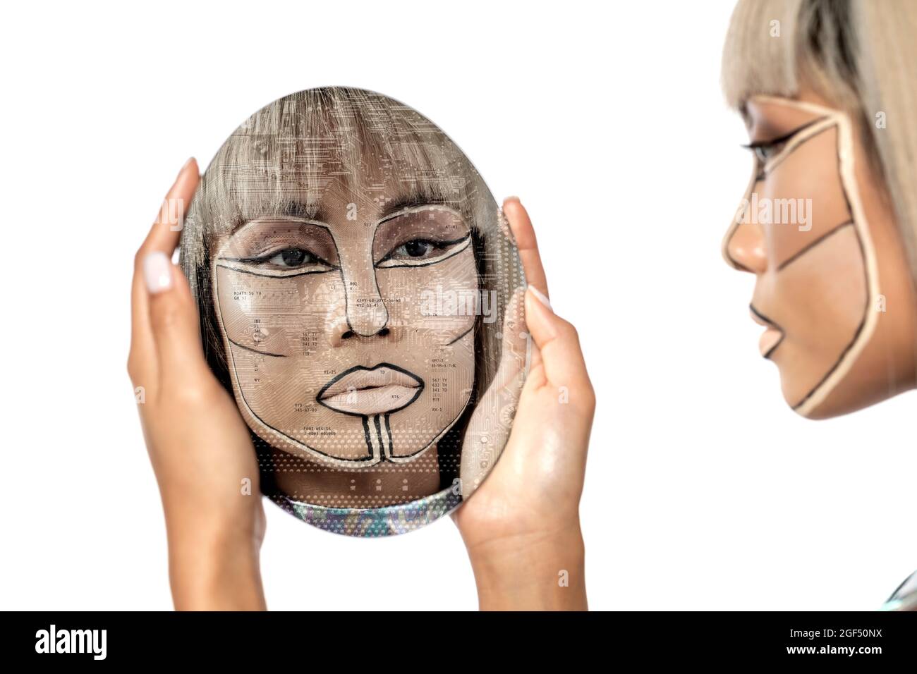 Cyborg woman looking at mirror reflection against white background Stock Photo