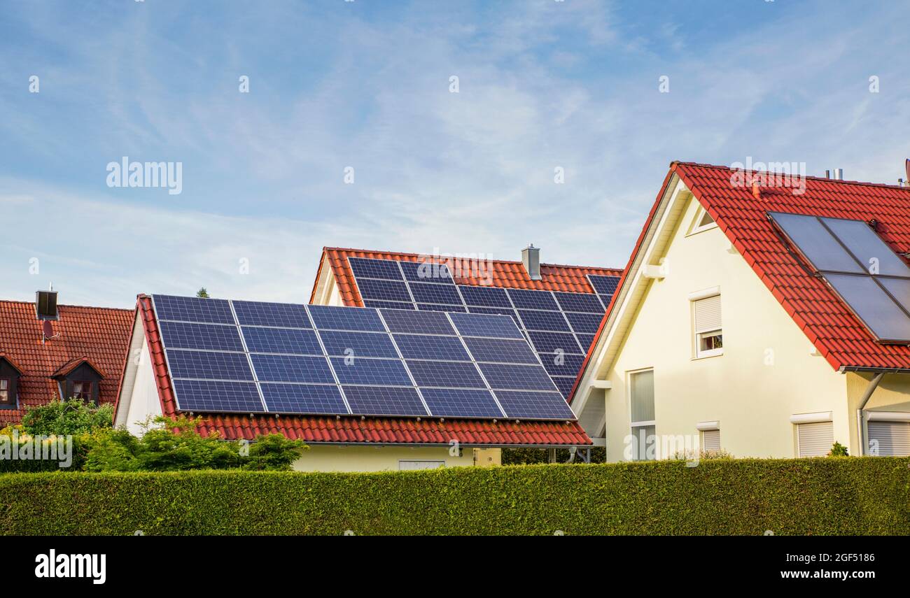 Suburb houses with tiled roofs and solar panels Stock Photo