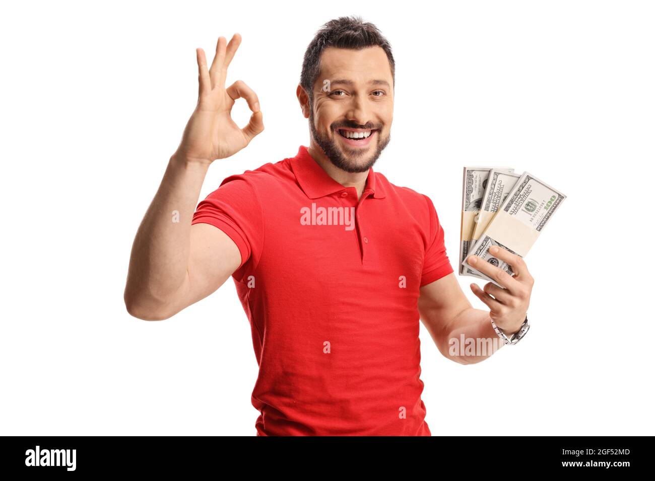 Guy in a red t-shirt holding cash and gesturing ok sign isolated on ...