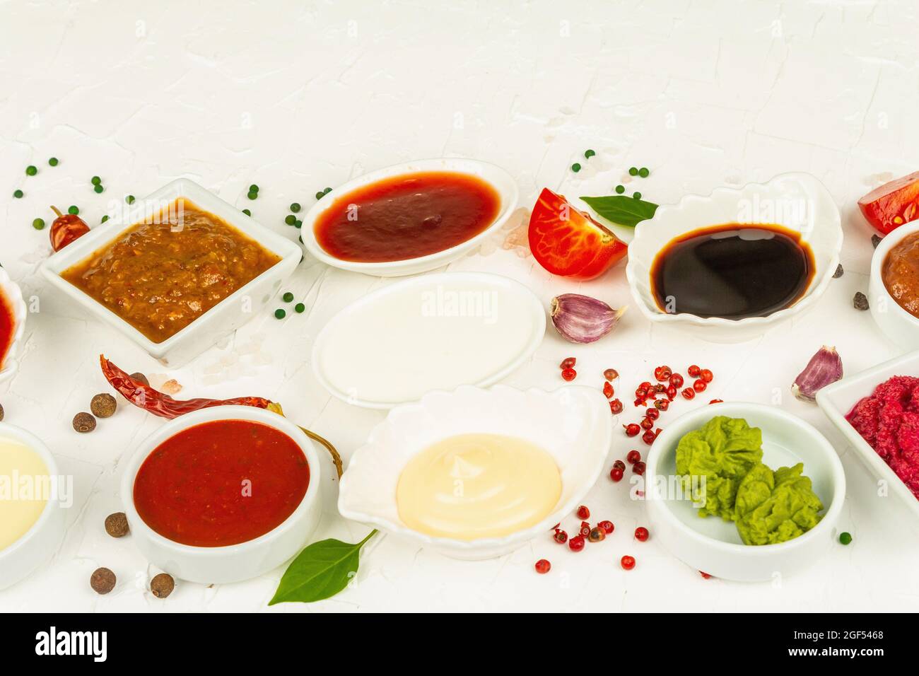 Set of different sauces - ketchup, mayonnaise, barbecue, soy, chutney,  wasabi, adjika, horseradish, aioli , marinara. White putty background, copy  spa Stock Photo - Alamy