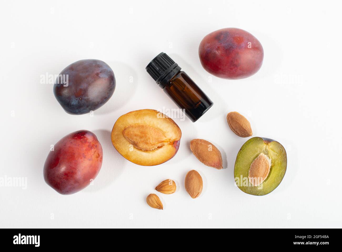 Plum kernel oil and fresh plum fruits. Organic cosmetic Stock Photo Alamy